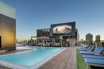 Rooftop resort-style pool with sundeck and spa